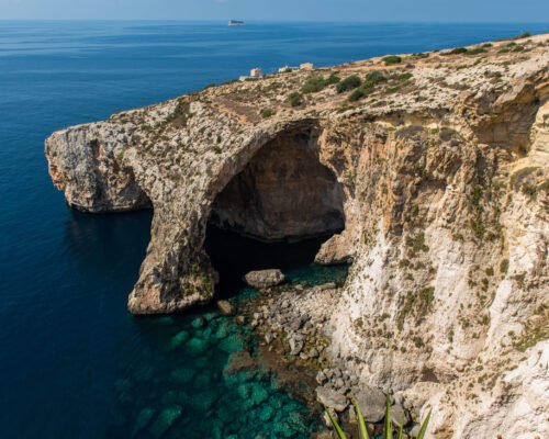 Blue grotto cave in Malta. Natural limestone arch over a lagoon