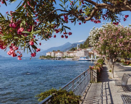 Lake Como, town Bellagio, Italy. Fascinating scenery of coastal town in famous and popular luxury summer resort. Boat ferry in the distance.